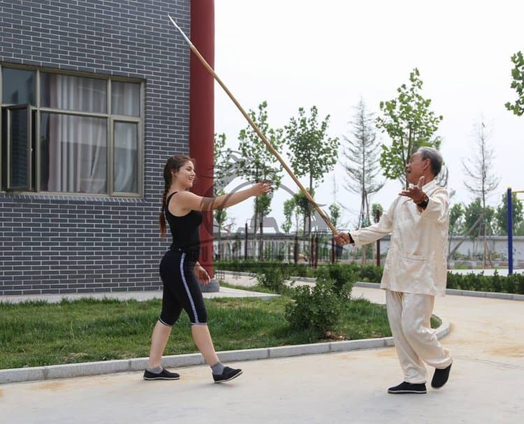 Sabina moving with a sword